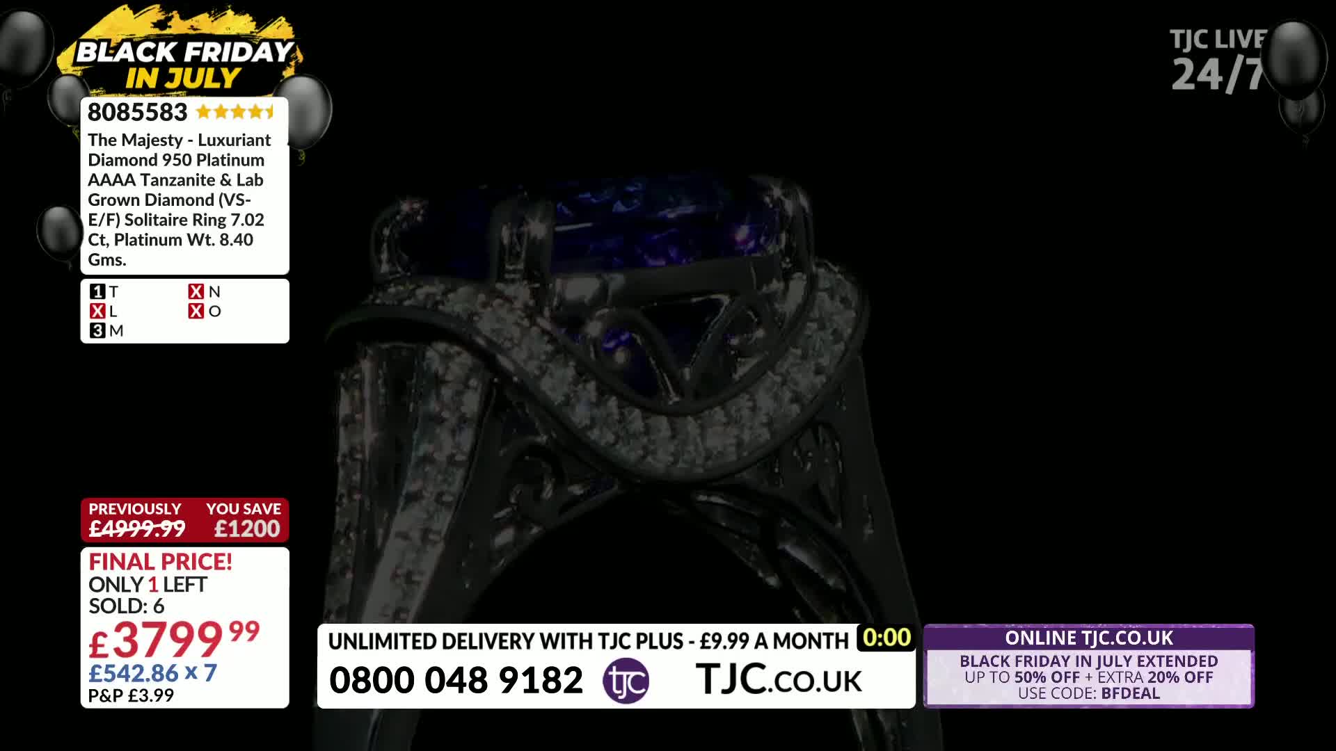 A close-up of a large ring with a dark setting and a prominent, deep purple gemstone is centered. The TJC screen displays the price and details of the ring against a black background.
