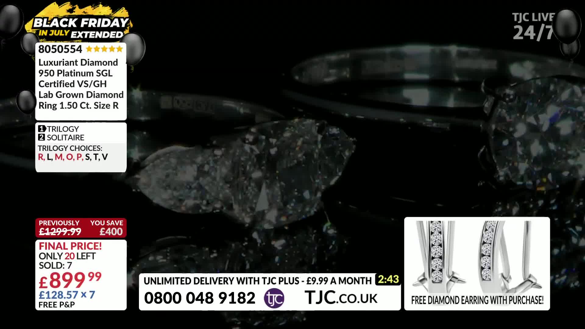 A diamond ring, sparkling under studio lights, is the focus. The TJC logo and price details for the ring are displayed on the screen.

