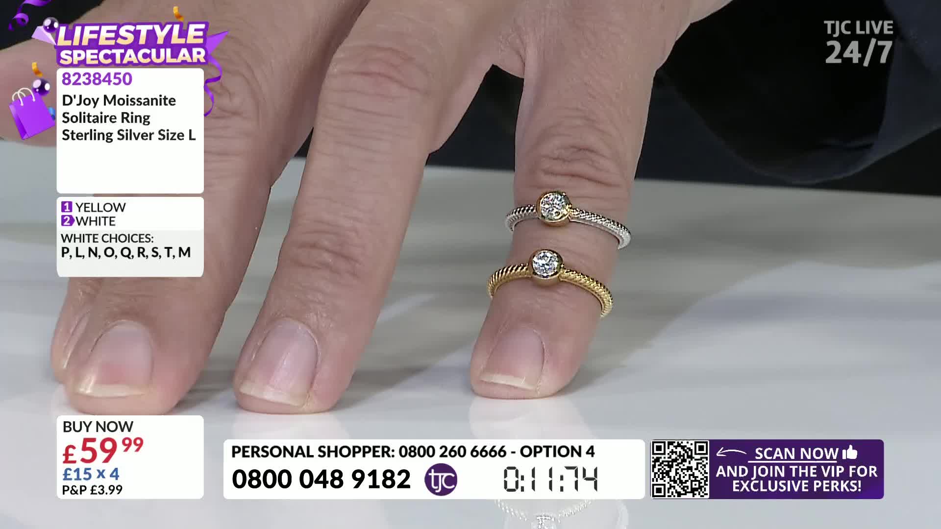 Two rings, one gold and one silver, sit on a finger, each with a sparkling stone. The TJC screen displays the price of the rings and other details about the product.
