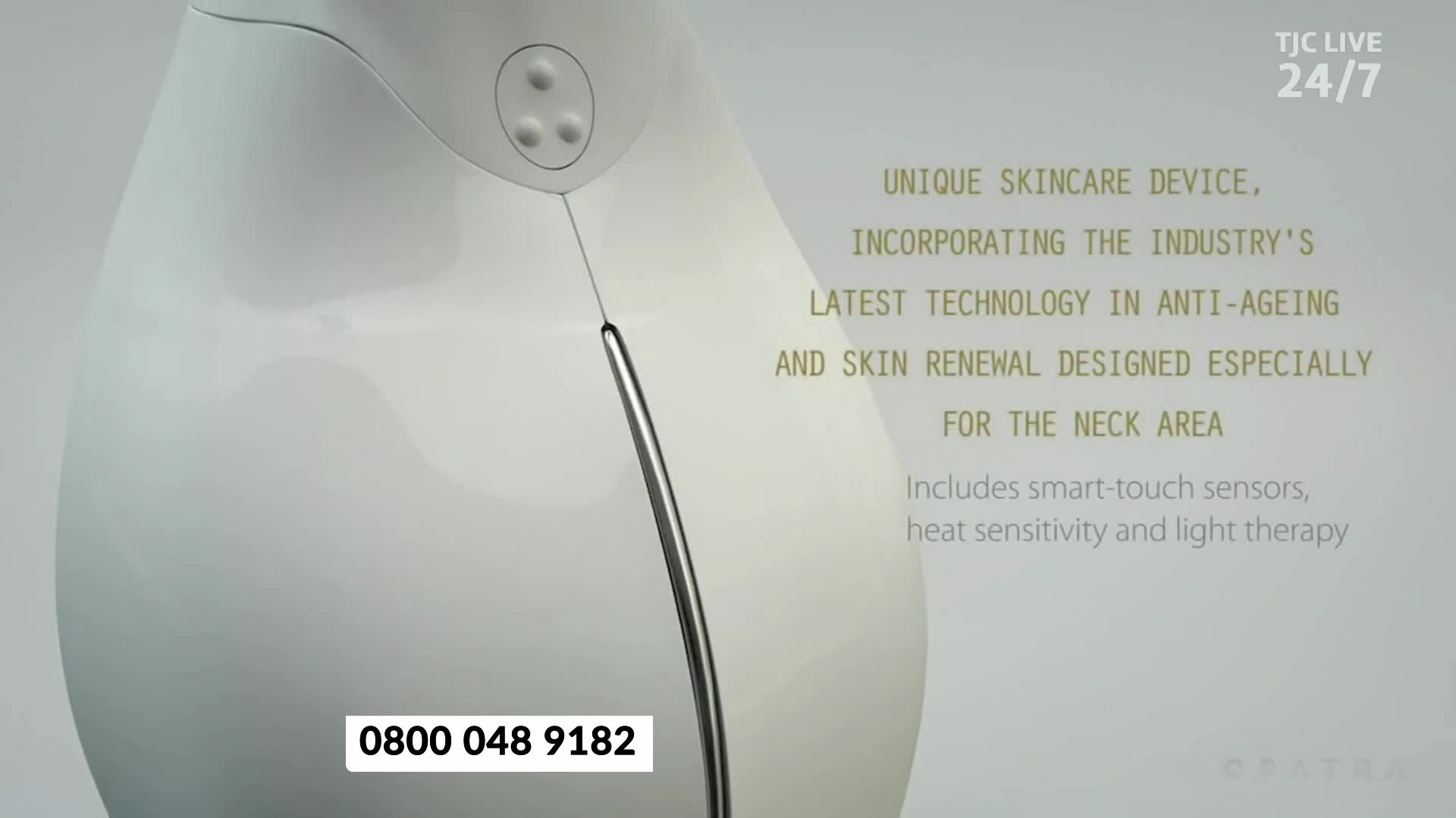 A sleek, white skincare device is displayed against a soft background, with text highlighting its features and a phone number for viewers in the United Kingdom to call. The TJC Live 24/7 logo is visible in the corner.
