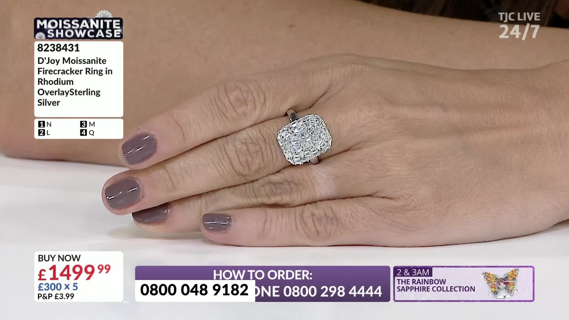 A hand, with painted nails, displays a large, square ring. It's a jewelry showcase on TJC, and the ring's price is prominently displayed.
