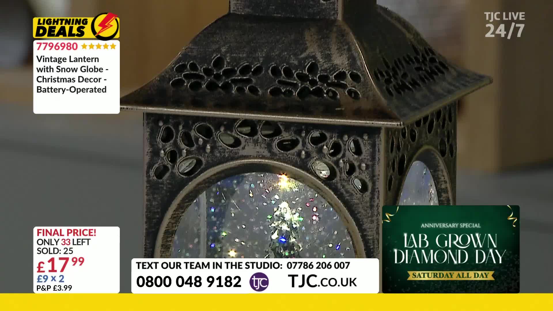 A vintage lantern with a snow globe inside sits on a table, the scene lit by a small tree. The TJC logo and a price tag are visible in the frame.
