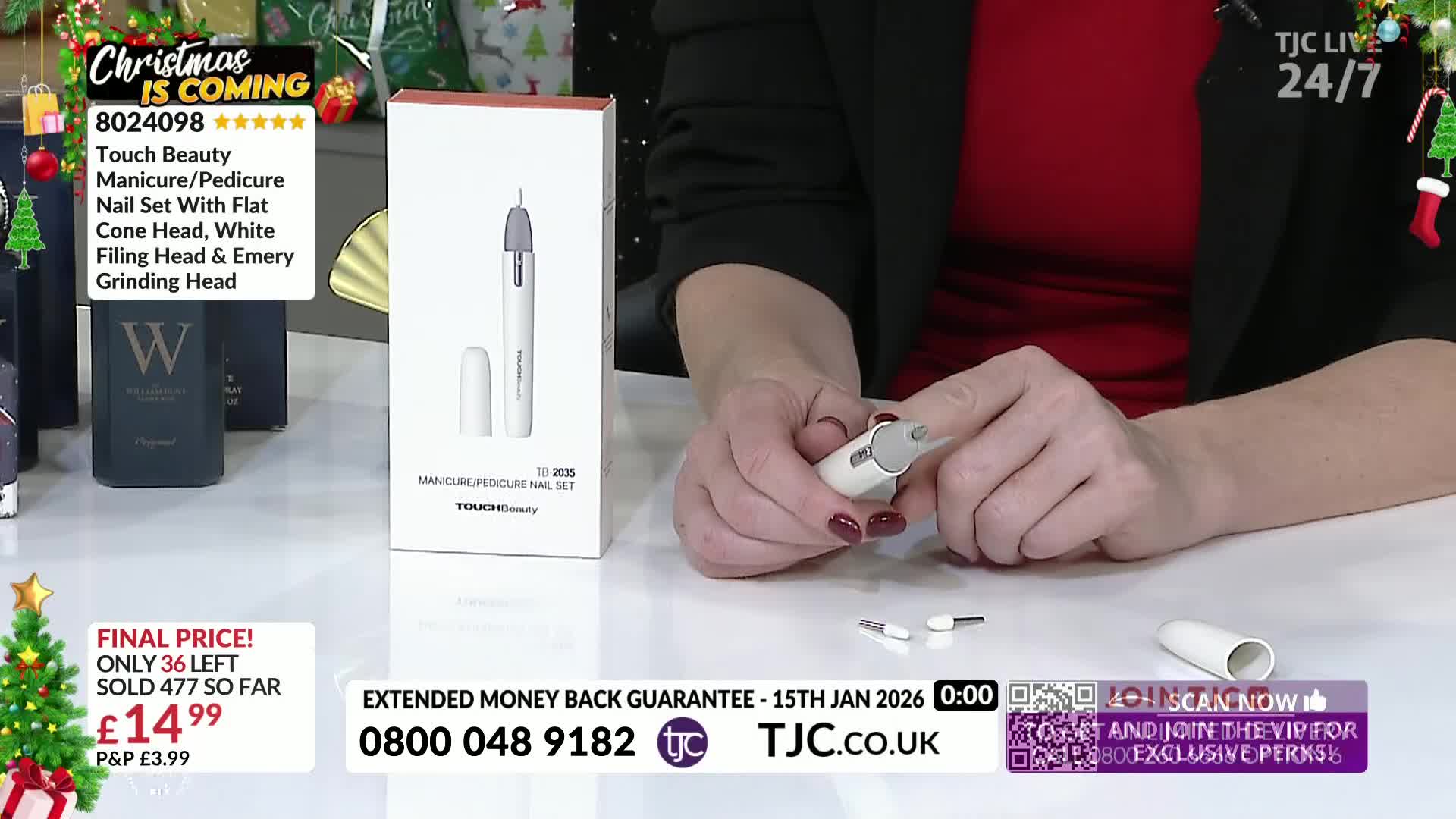 A woman holds a small white nail tool, demonstrating how to change the head. Several attachments are laid out on the table, alongside the product packaging from TJC.
A woman holds a small white nail tool, demonstrating how to change the head. Several attachments are laid out on the table, alongside the product packaging from TJC.