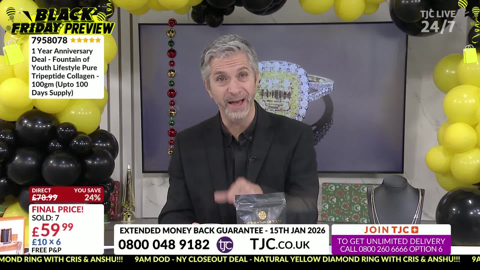 A man in a black suit gestures enthusiastically, holding a small package in his hand. Behind him, a screen displays a large diamond ring, all part of a TJC Black Friday preview.
A man in a black suit gestures enthusiastically, holding a small package in his hand. Behind him, a screen displays a large diamond ring, all part of a TJC Black Friday preview.