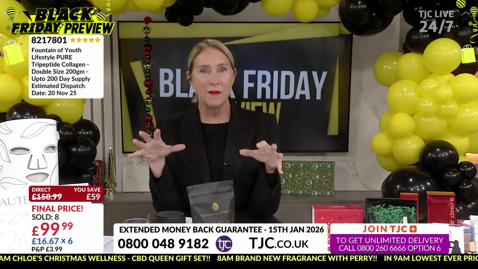The woman, on a TJC set, gestures with both hands as she speaks. Behind her, black and yellow balloons decorate the space for a Black Friday preview.
The woman, on a TJC set, gestures with both hands as she speaks. Behind her, black and yellow balloons decorate the space for a Black Friday preview.