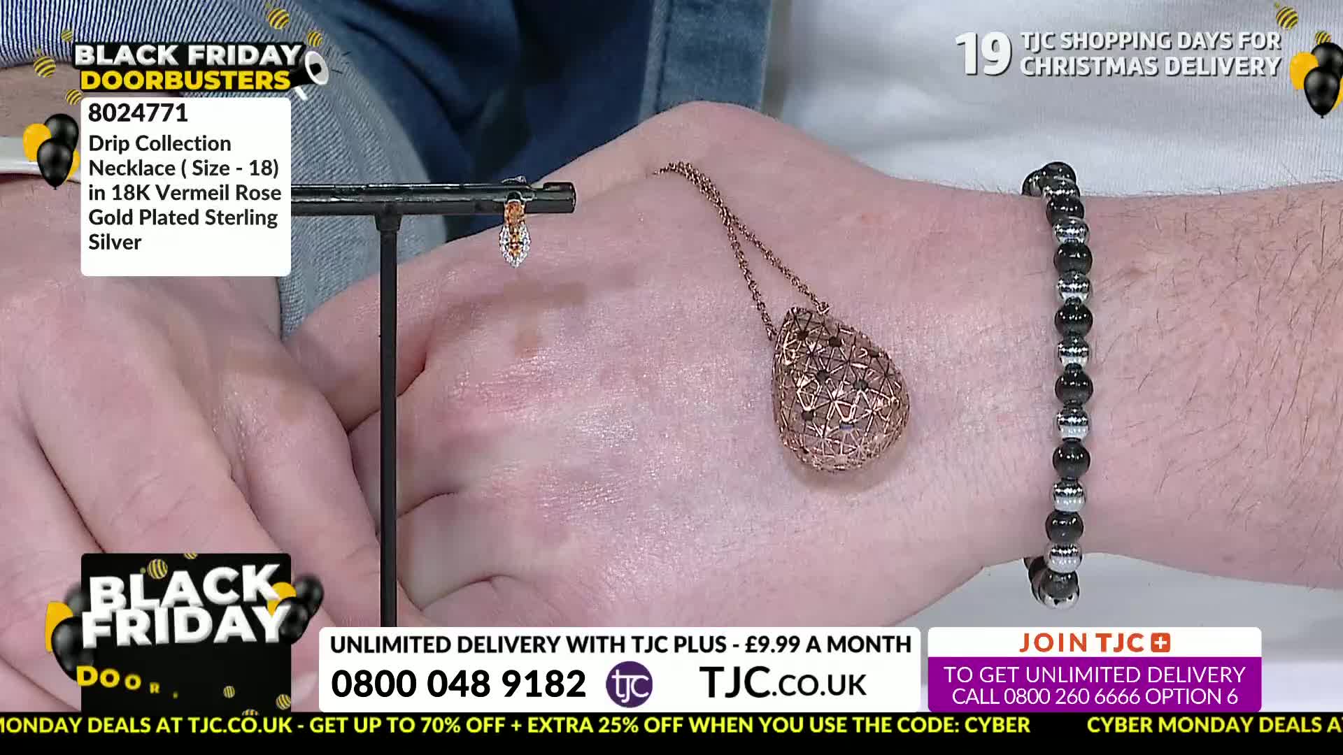 A hand displays a rose gold pendant necklace and a matching bracelet, likely for a TJC jewelry sale. A small earring hangs from a stand, and the Black Friday deals are advertised on screen.
A hand displays a rose gold pendant necklace and a matching bracelet, likely for a TJC jewelry sale. A small earring hangs from a stand, and the Black Friday deals are advertised on screen.