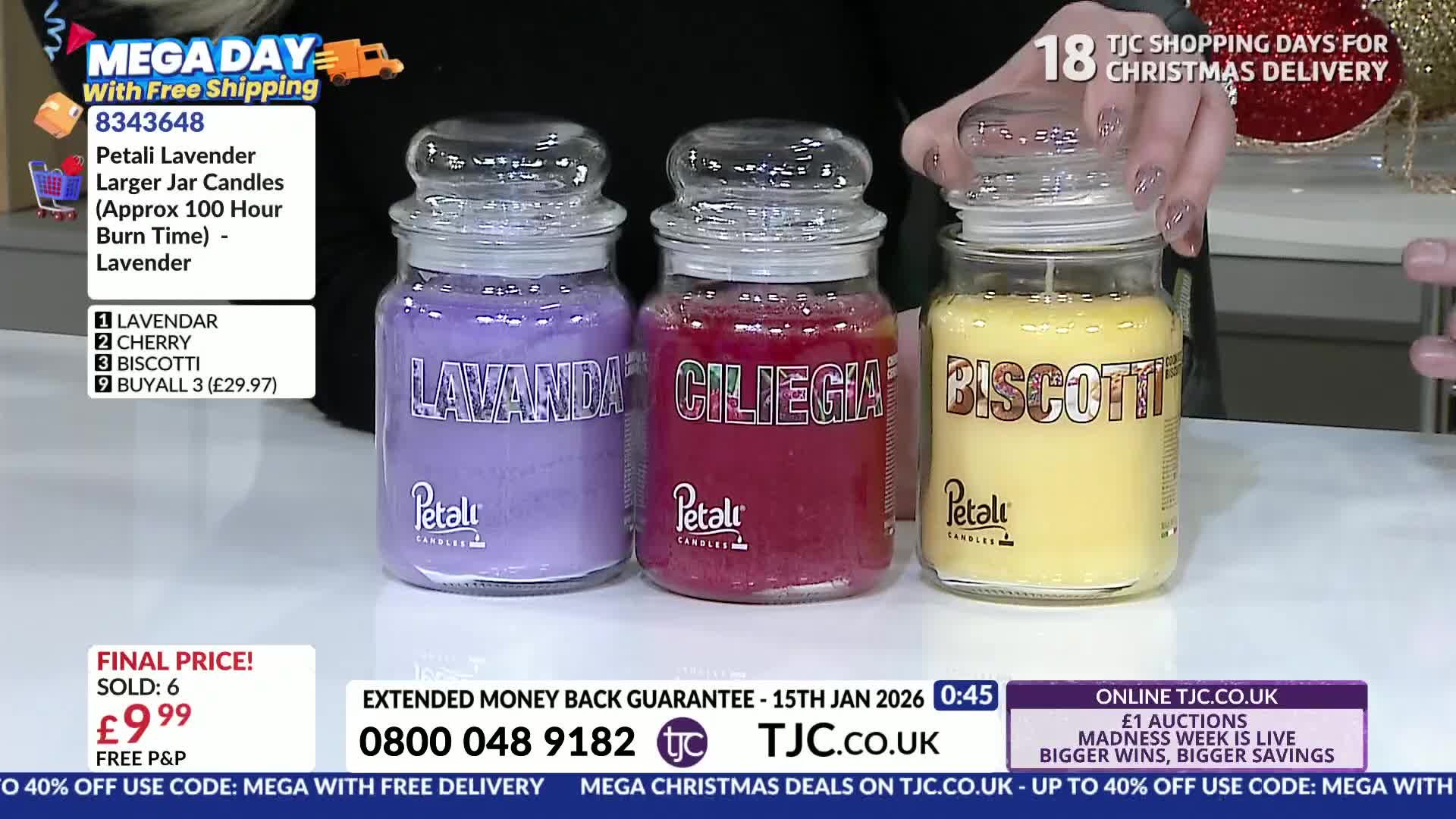Three glass jar candles, labeled "Lavendar," "Ciliegia," and "Biscotti," sit on a table. A hand is lifting the lid off the "Biscotti" candle, likely during a TJC shopping segment.
Three glass jar candles, labeled "Lavendar," "Ciliegia," and "Biscotti," sit on a table. A hand is lifting the lid off the "Biscotti" candle, likely during a TJC shopping segment.