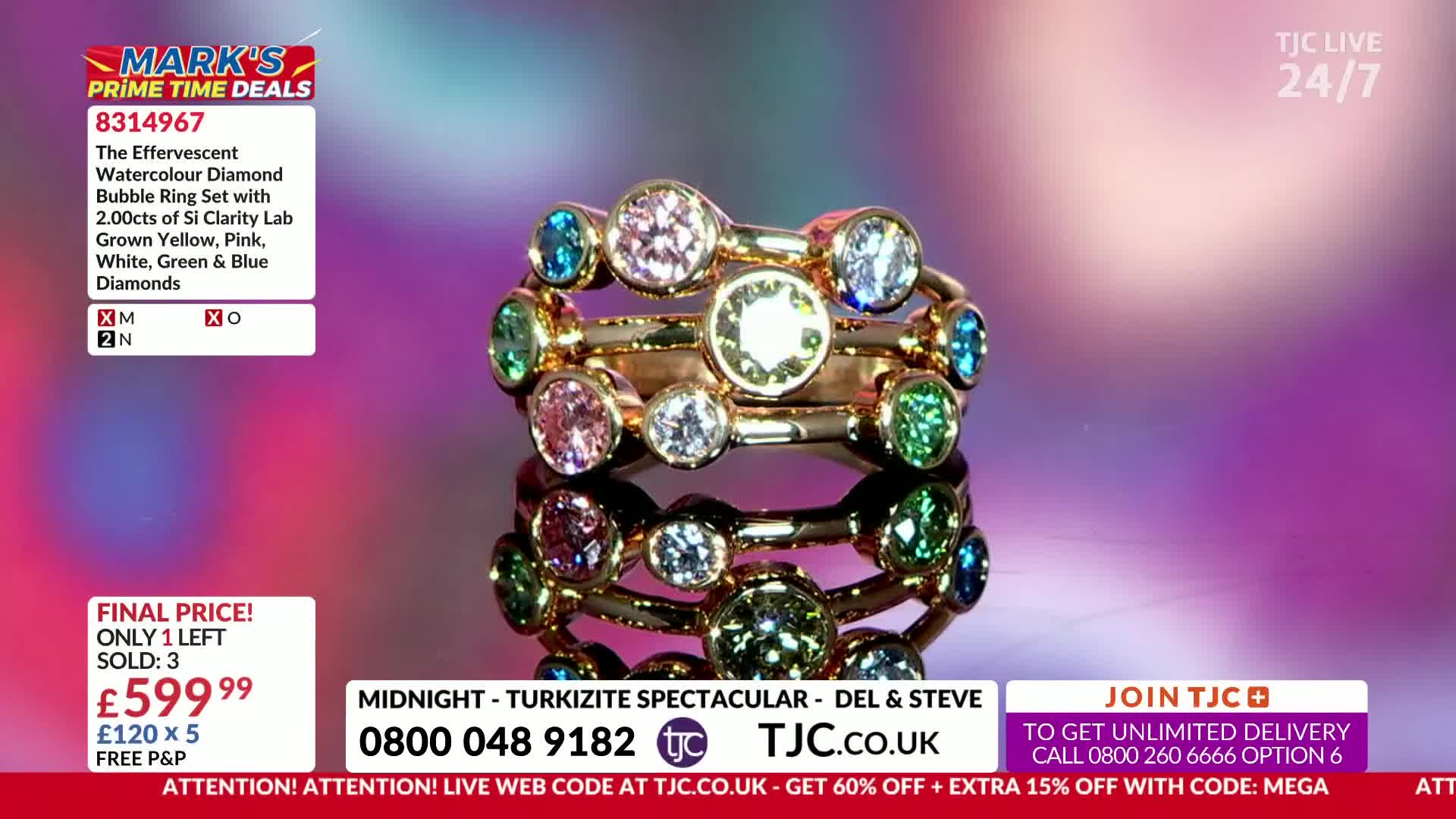 The Effervescent Watercolour Diamond Bubble Ring Set, featuring a mix of yellow, pink, white, green, and blue diamonds, is displayed on a reflective surface. This TJC offering, priced at £599.99, has only one left.