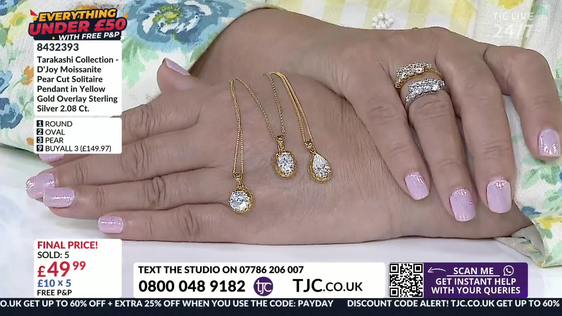 Three gold necklaces, each with a single sparkling stone, rest on a woman's hand. Her nails are painted a pale lavender, and she wears two diamond rings. Three gold necklaces, each with a single sparkling stone, rest on a woman's hand. Her nails are painted a pale lavender, and she wears two diamond rings.