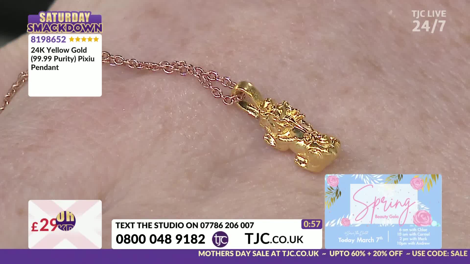 A delicate gold chain holds a detailed, golden pendant. The pendant, a Pixiu, gleams against a soft, textured background.