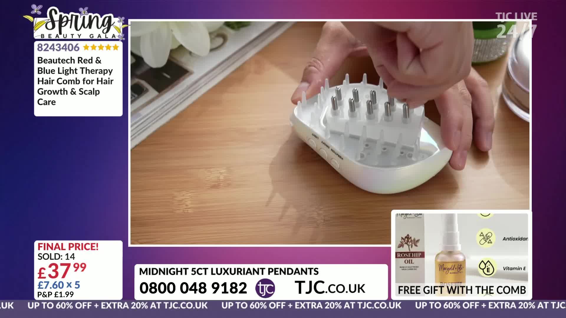 Fingers press down on the silver prongs of a white hair comb. The comb sits on a light wood surface, next to a stack of magazines.