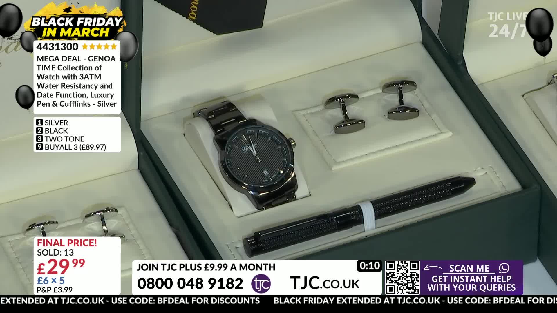 A dark metal watch, a matching pen, and two cufflinks sit neatly in their presentation box. The TJC logo and "Black Friday in March" graphics are displayed on the screen.