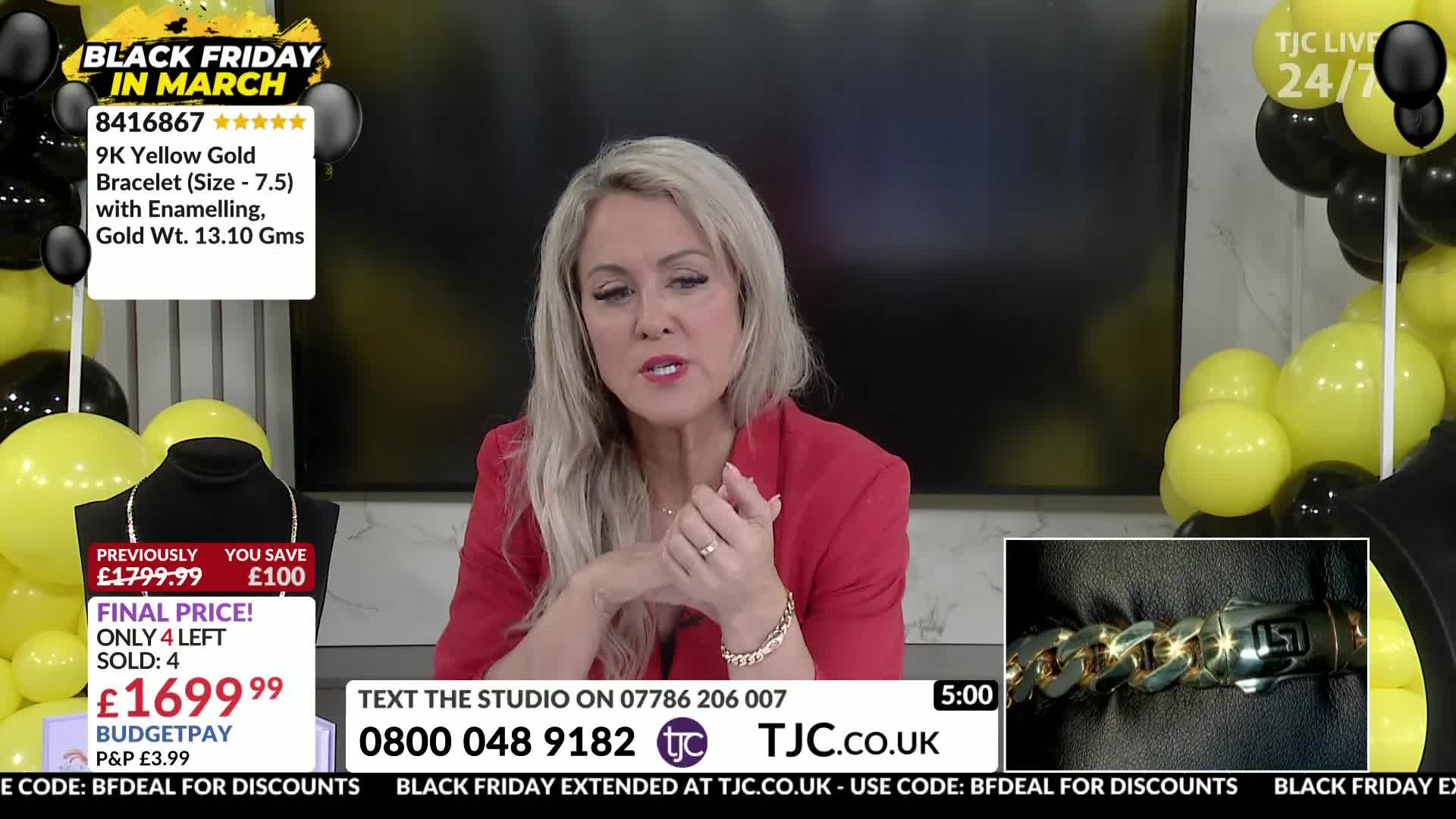 A woman in a red jacket gestures with her hands while speaking. A close-up inset shows a heavy gold bracelet with a distinctive clasp.