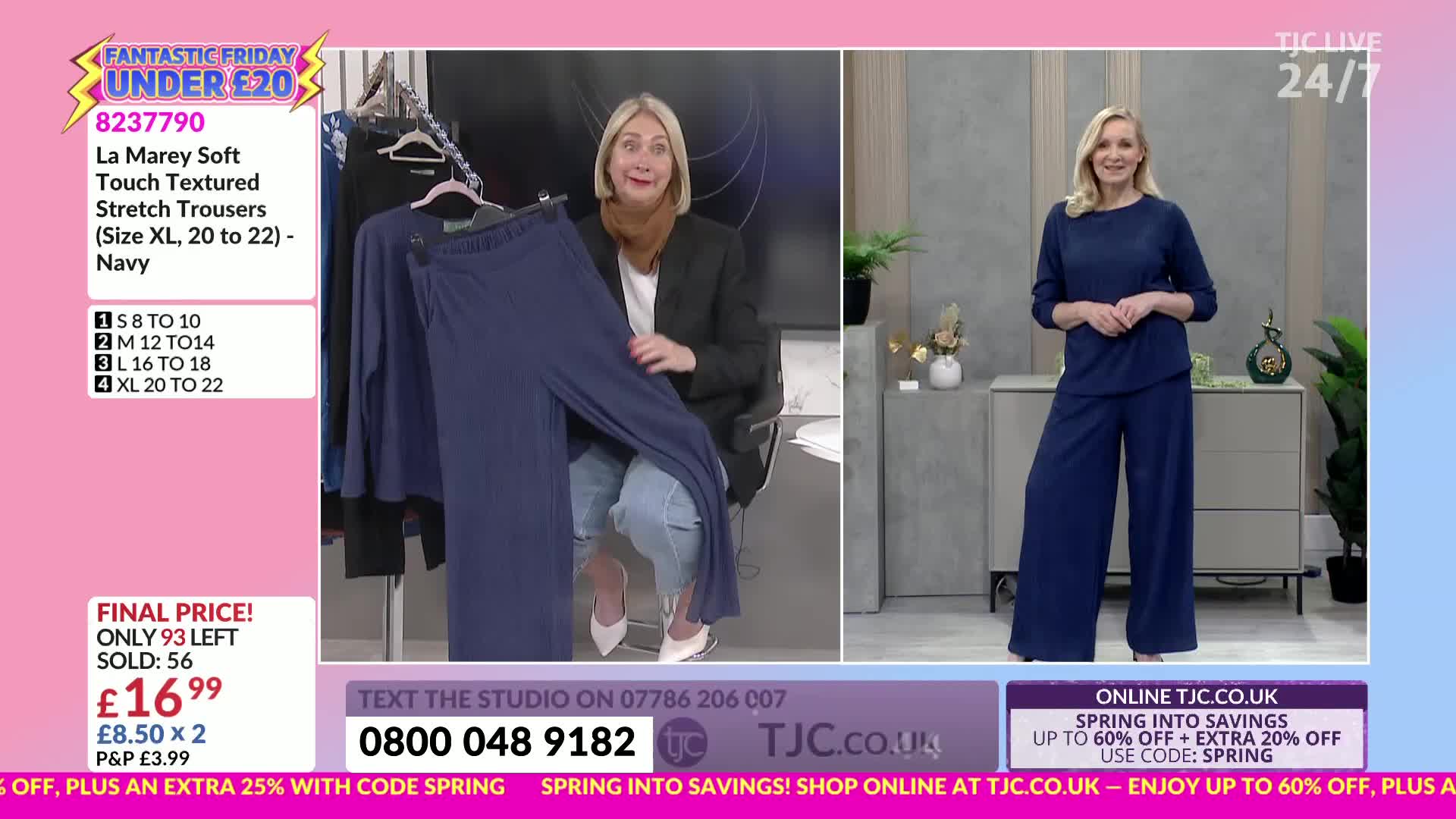 A woman holds up a pair of navy blue trousers, displaying their wide leg and soft texture. Another woman stands nearby, modelling a matching navy blue top and trousers set.