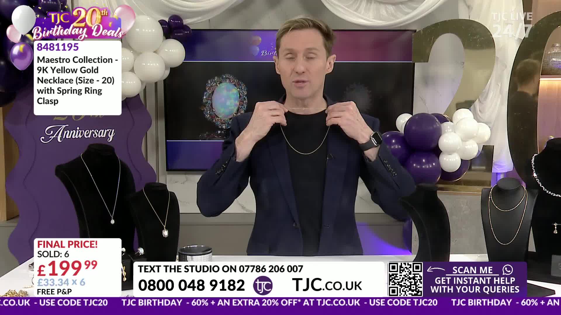 The presenter holds a delicate gold chain around his neck. A graphic lists the item as a 9K yellow gold necklace for £199.99.