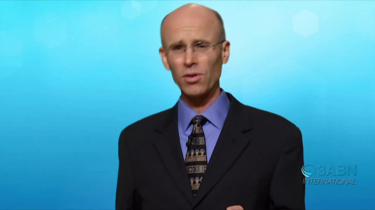 A man in a suit and tie, framed against a blue backdrop, is speaking directly to the camera. The 3ABN International logo is visible in the bottom right corner.

