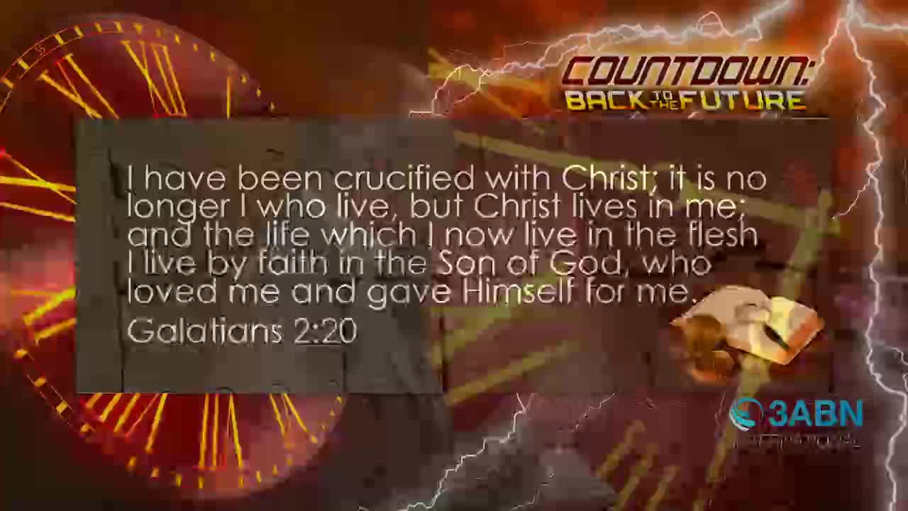 A large clock face with glowing red hands dominates the left side of the screen. Text from Galatians 2:20 appears in a white box, overlaid on a background of lightning and the 3ABN International logo.