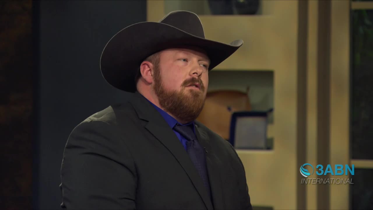 A man in a black cowboy hat and suit speaks. The 3ABN International logo is visible in the corner.