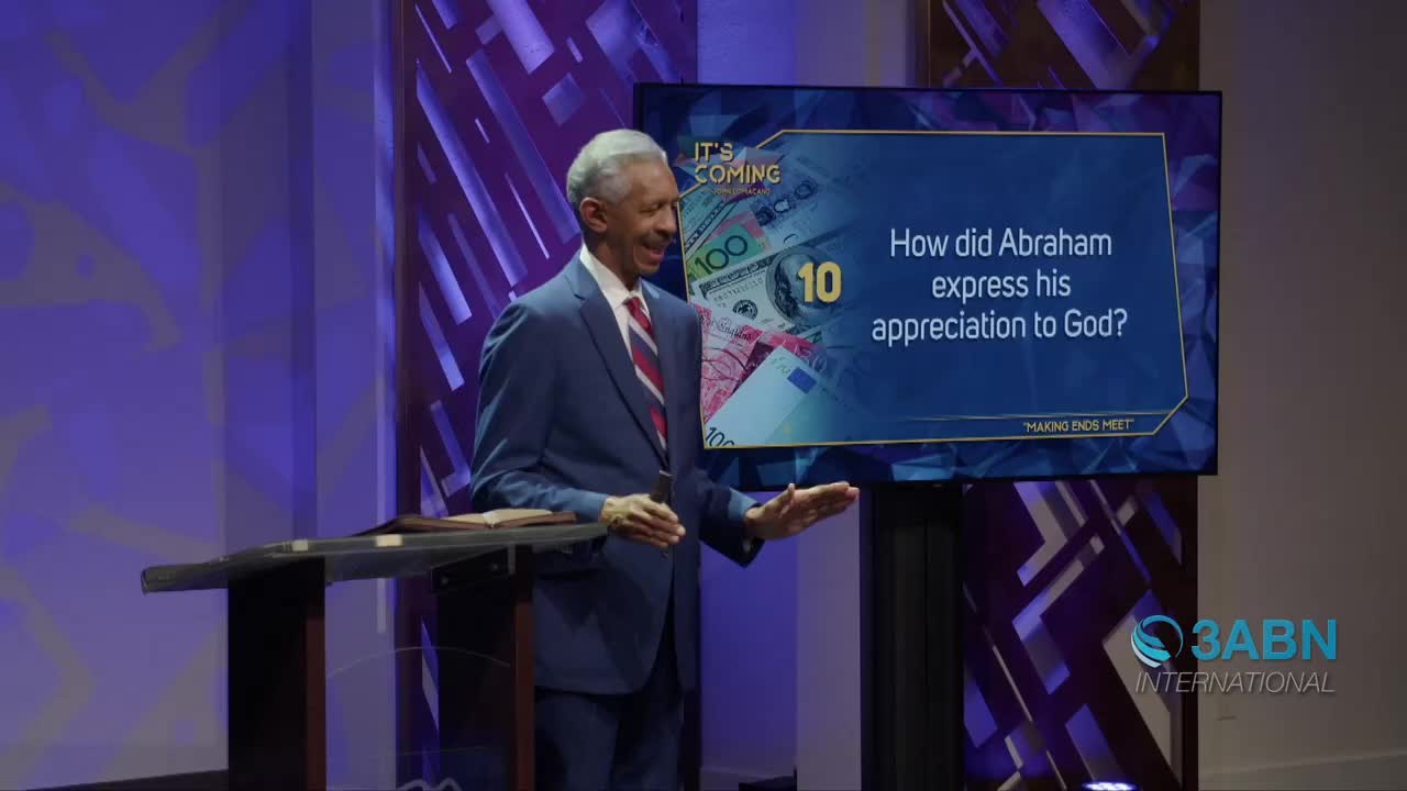 A man in a blue suit stands on a stage, gesturing with his hands as a question about Abraham's appreciation to God appears on a large screen behind him. The 3ABN International logo is visible in the lower right corner.