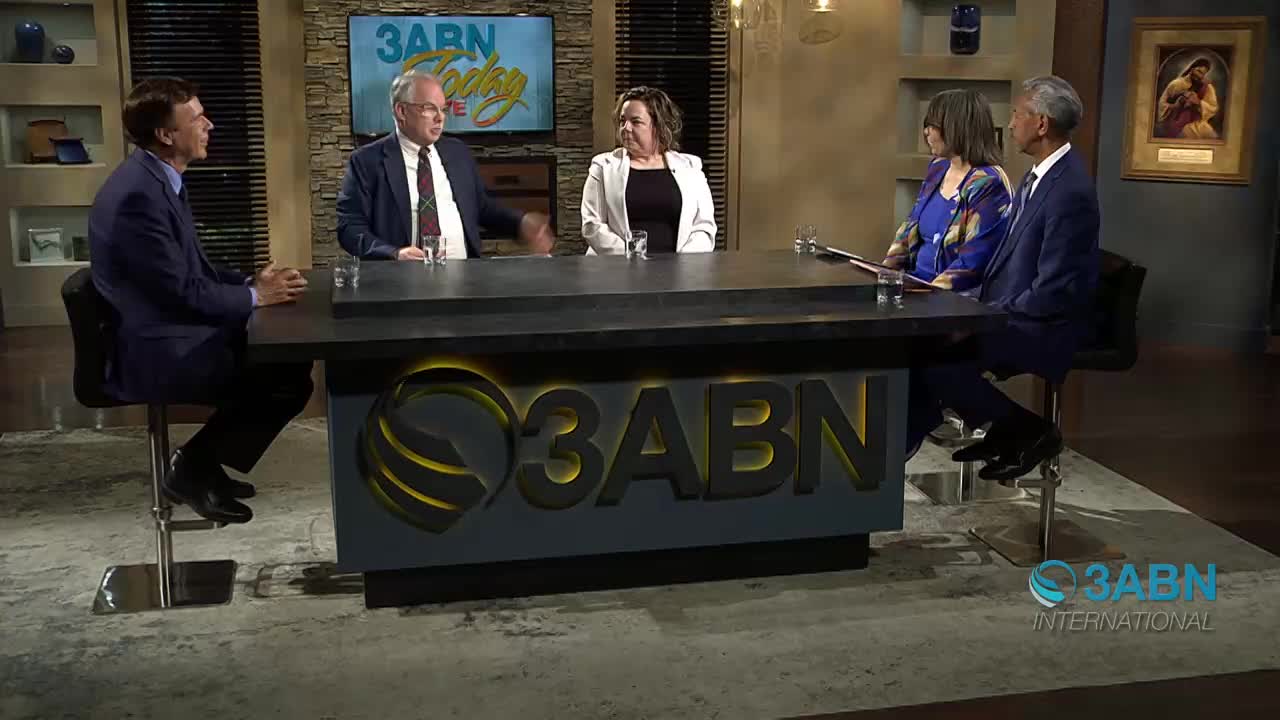 Five people are seated around a table on a set. A screen behind them displays "3ABN Today."