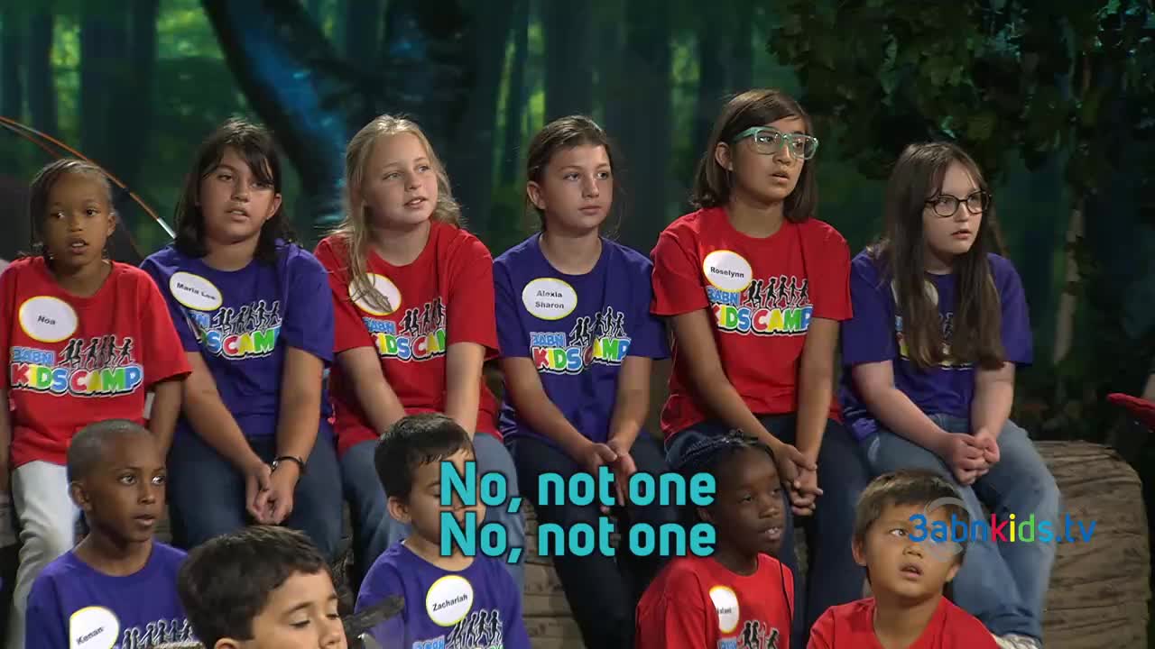 Children, dressed in red and blue shirts, sit on a log, their faces reflecting a shared emotion as they listen. The words "No, not one" appear on the screen, echoing the children's expressions.
