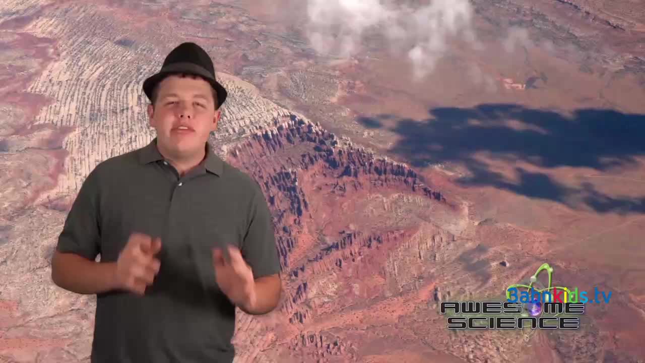 A man in a hat gestures with his hands in front of a backdrop of a canyon. The 3ABN Kids "Awesome Science" logo is visible in the lower right corner.
