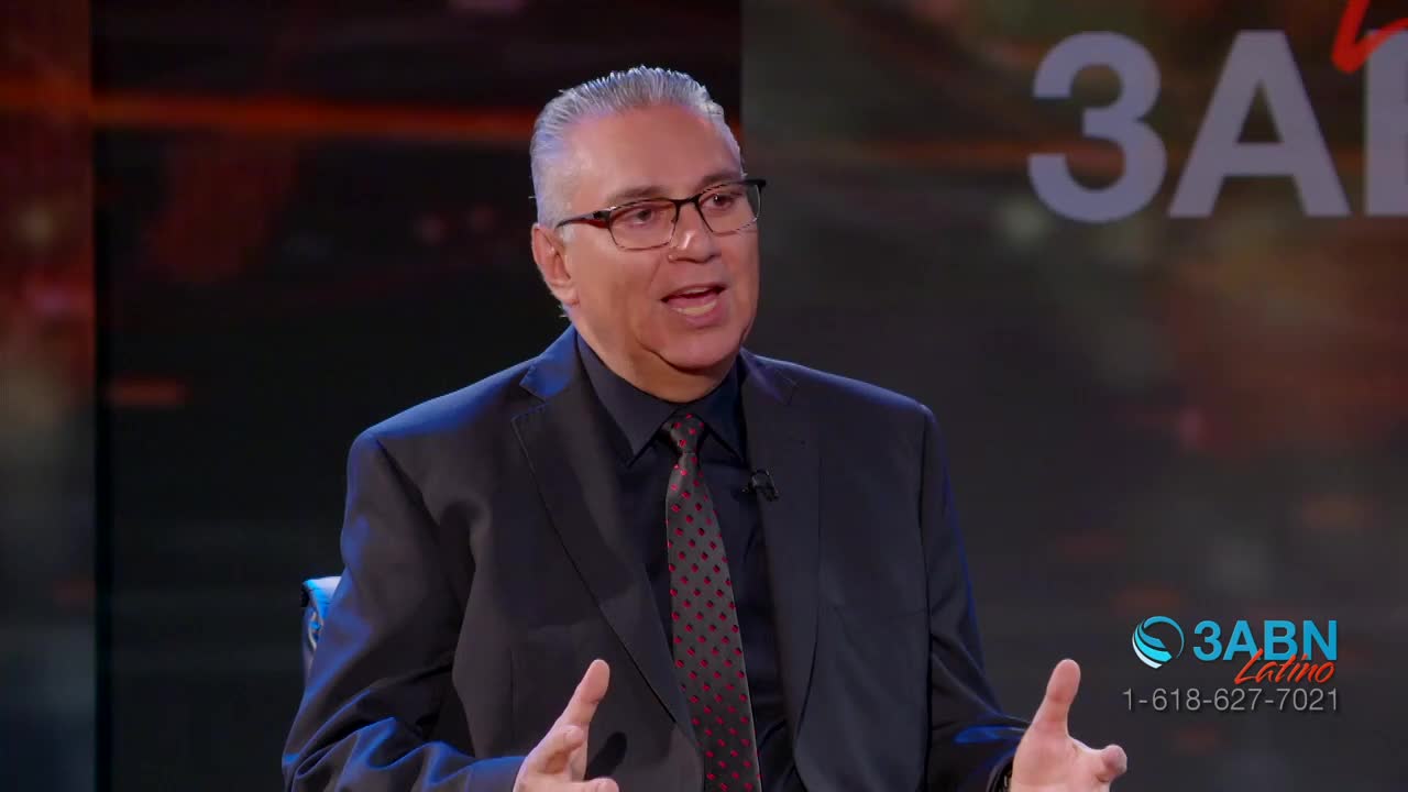 A man in a suit gestures with his hands while speaking. The 3ABN Latino logo appears on screen.
