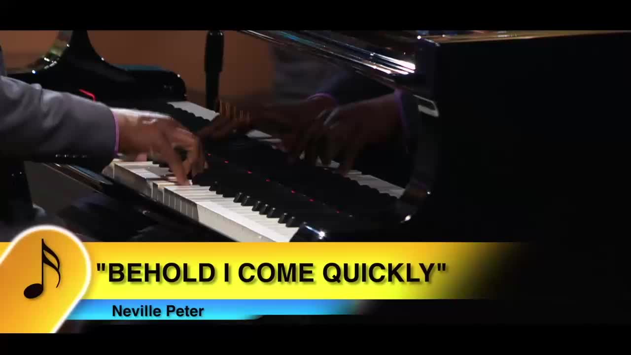 A man's hands glide across the piano keys, playing a song on the 3ABN Praise Him Music Network. The title "Behold I Come Quickly" appears on the screen.

