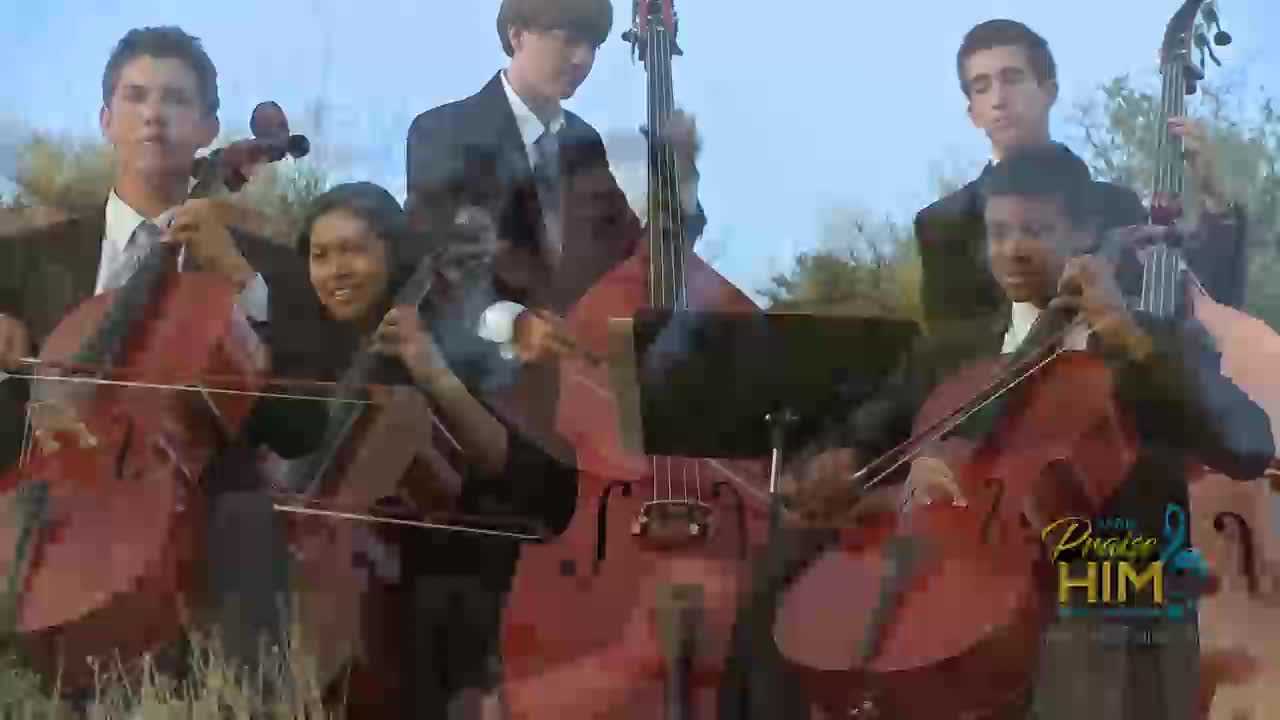 Cellists in suits are playing their instruments outdoors, with a backdrop of trees and a pale sky. The 3ABN Praise Him Music Network logo is visible in the corner.
