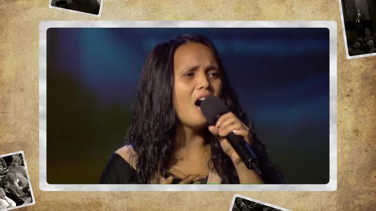 A young woman sings into a microphone, her eyes closed in passionate worship. Her voice fills the space, a powerful sound broadcast across the 3ABN Praise Him Music Network.