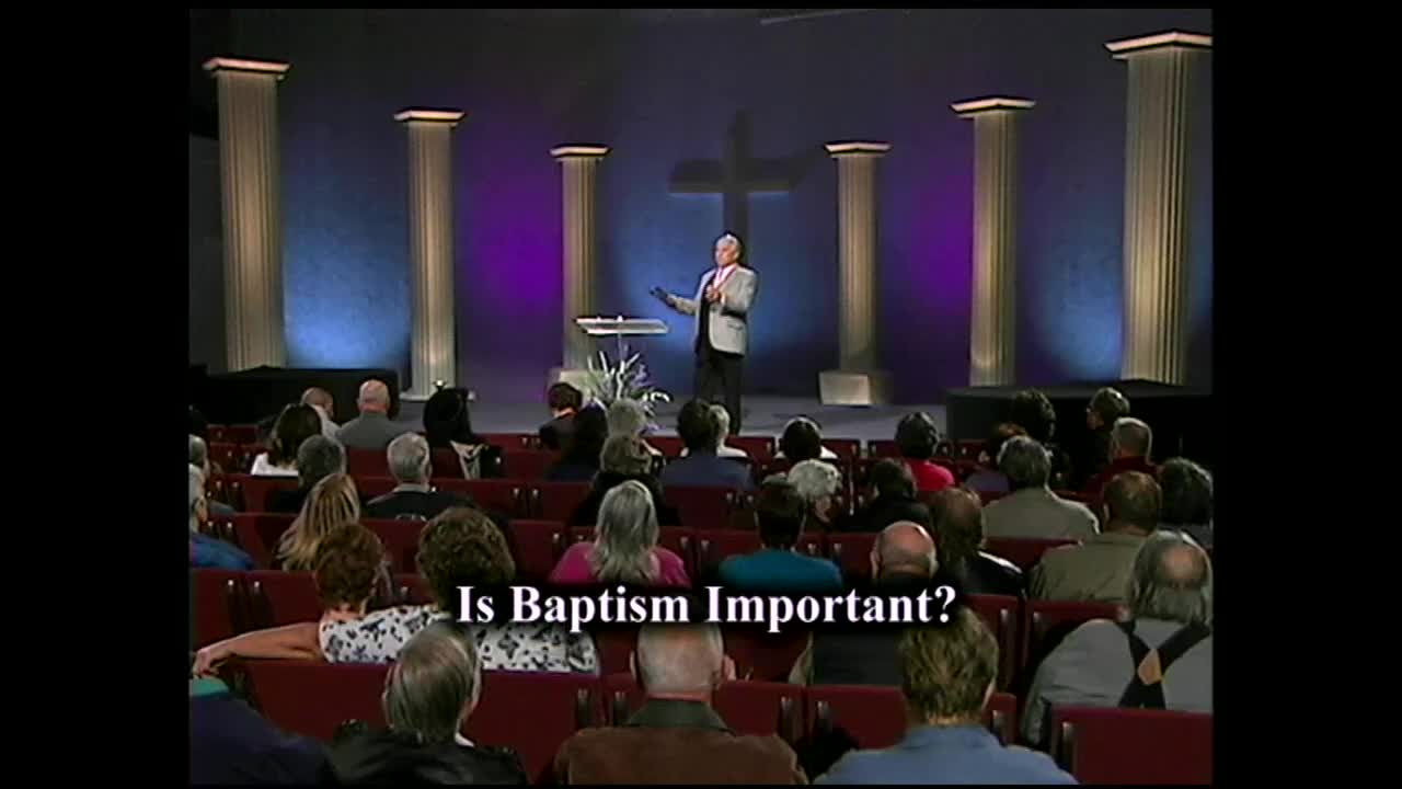 A man in a suit stands on a stage, gesturing with his hands as he speaks to an audience seated in rows of chairs. The 3ABN Proclaim! Network logo is visible, suggesting this is a broadcast from the United States.