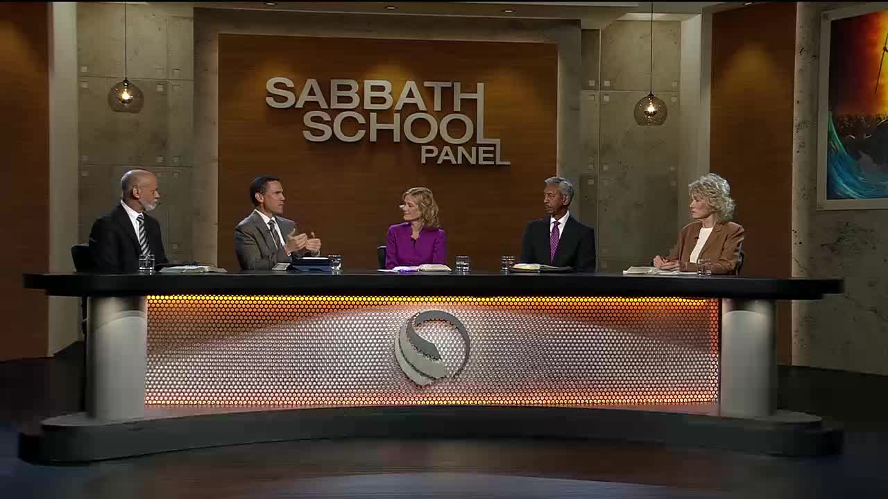 Five people sit at a long table, bathed in warm studio lights. The 3ABN Proclaim! Network logo is visible on the front of the table.