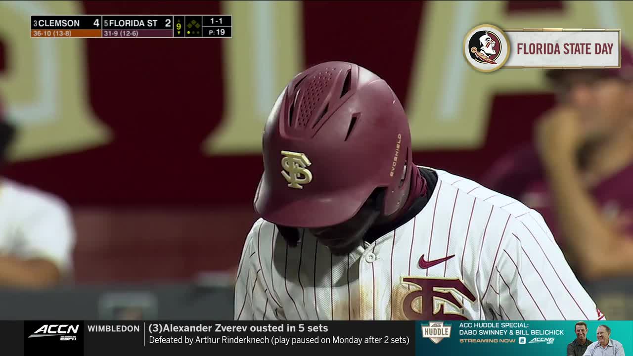 The Florida State batter, in his maroon helmet, has his head bowed, the Seminoles logo prominent. The ACC Network's scoreboard shows Clemson leading, and the broadcast is interrupted with a Wimbledon update.
