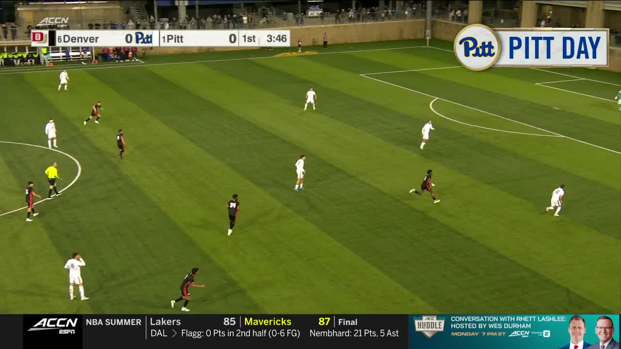 The Denver team, in maroon, is trying to advance the ball upfield. The Pitt players, in white, are moving to defend, with the score still tied at zero.
