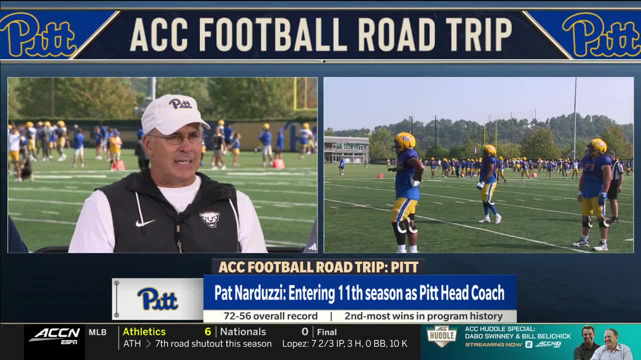 On the left, Pat Narduzzi, in a white hat, is talking, while on the right, players in blue and gold uniforms stand on the field. The ACC Network is broadcasting from a Pitt football practice.
