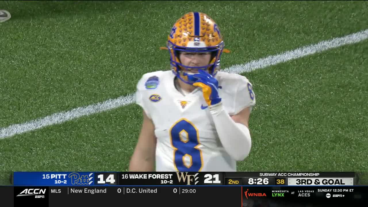 A player in a Pitt uniform stands on the field, fingers touching his facemask. The ACC Network broadcast shows Wake Forest leading in the second quarter of the Subway ACC Championship game.
