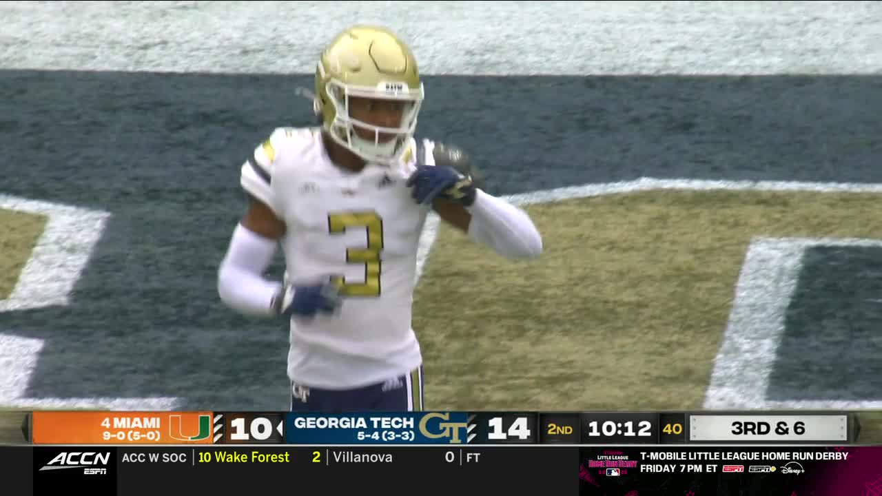 A Georgia Tech player, wearing a gold helmet and the number 3, is jogging on the field. The ACC Network broadcast shows the score as 14-10 in the second quarter.
