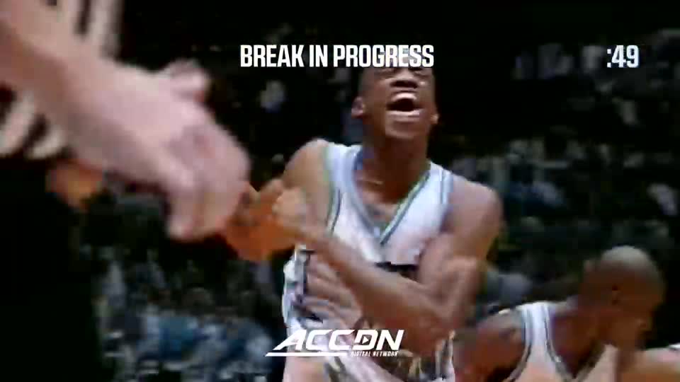 A basketball player in a white and teal jersey is yelling, his arms raised in celebration. The ACC Network logo is visible as the clock ticks down.
