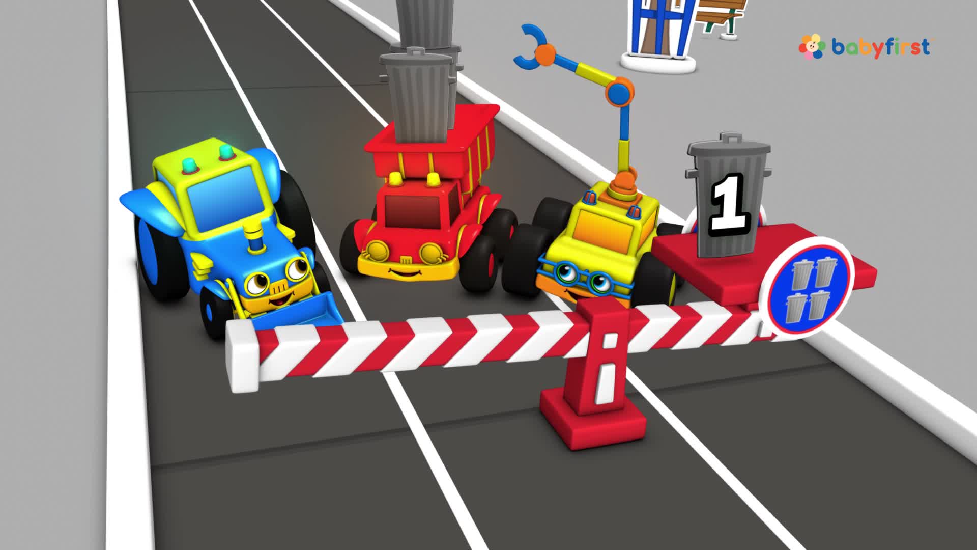 A blue truck, a red truck, and a yellow truck are lined up behind a red and white barrier. The yellow truck has a mechanical arm reaching up, and a trash can sits atop a red platform.
