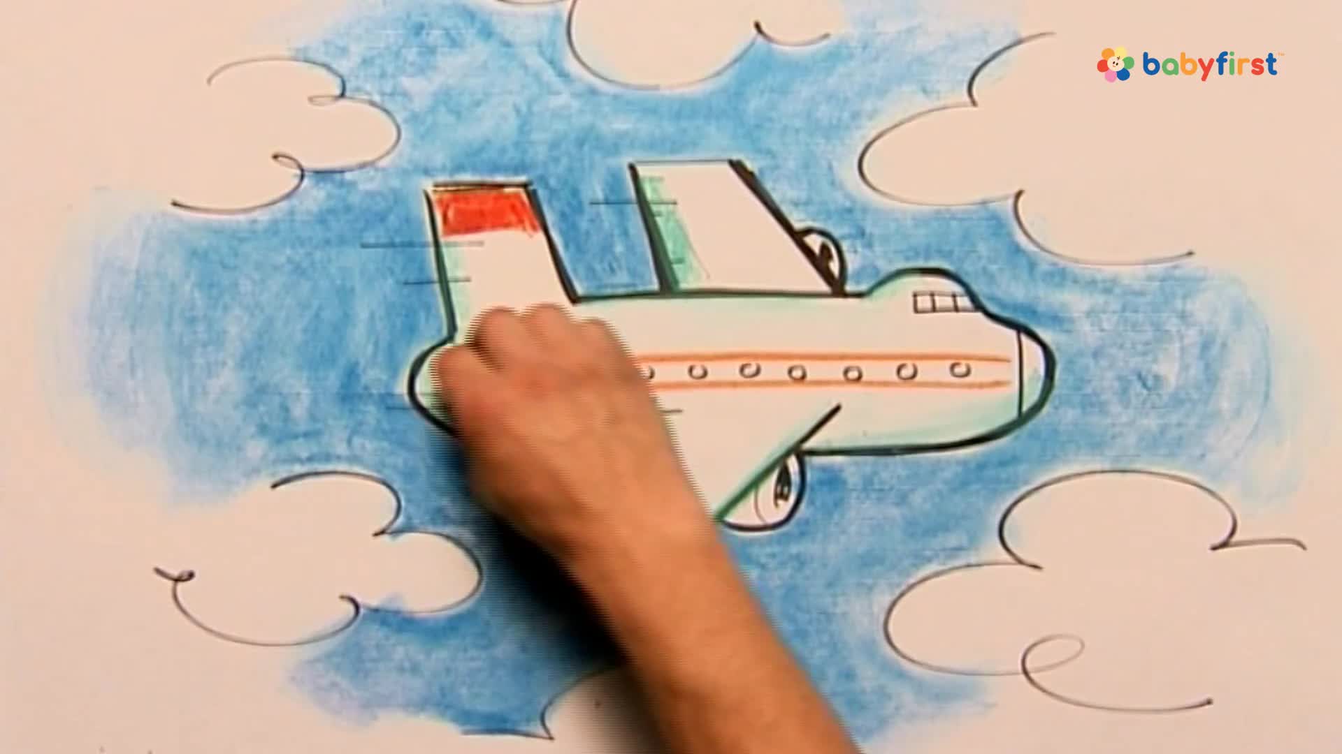 A hand is coloring a cartoon airplane, its red tail contrasting against the blue sky background. The plane is drawn with black outlines, and the hand is adding green to its wings.
