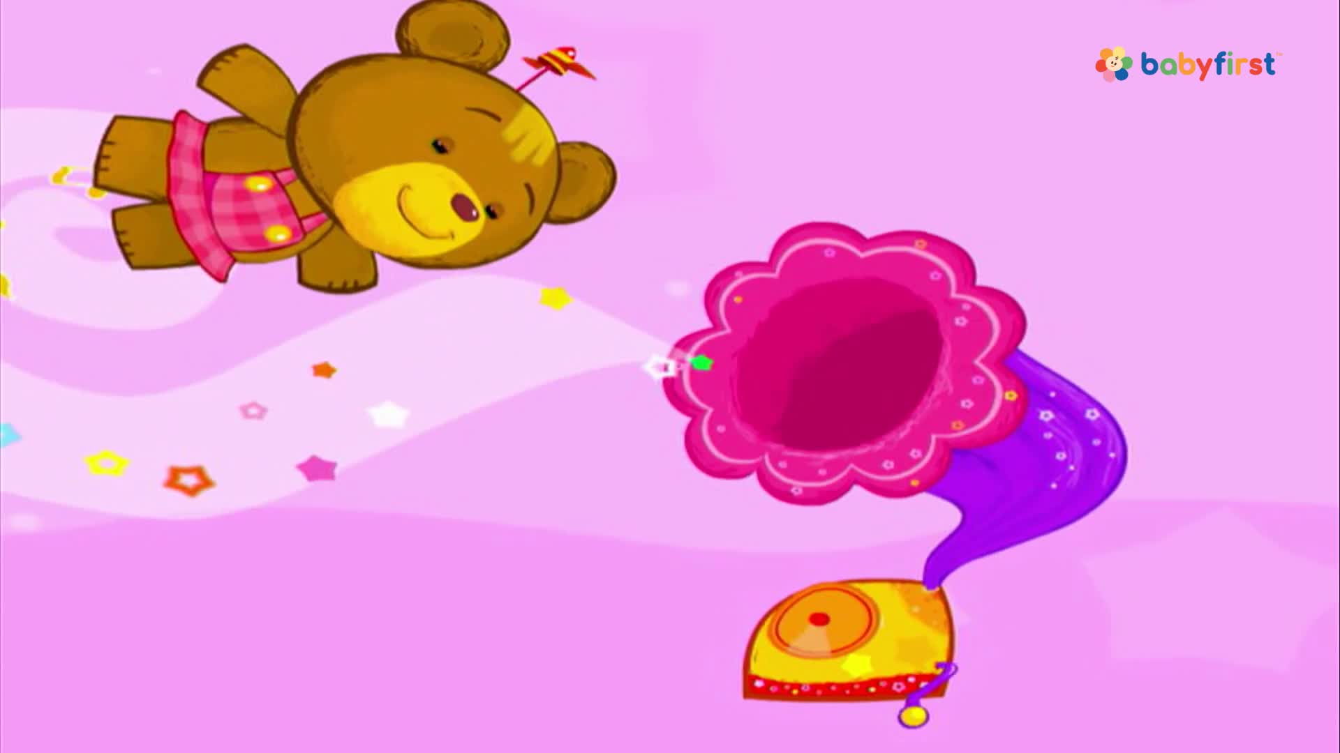 A smiling teddy bear, wearing a pink dress, floats above a pink background. A cartoon gramophone is positioned to the right, with a flower-shaped horn.
