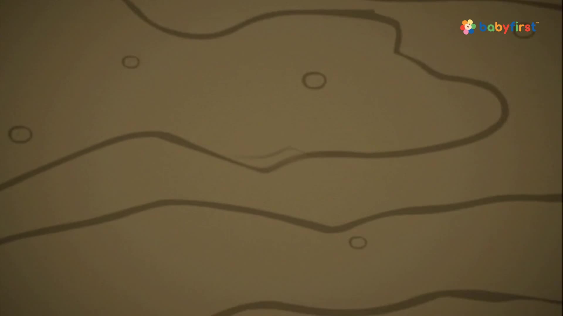 The screen displays a tan background with several wavy, dark gray lines. Small, circular shapes float randomly across the surface.
