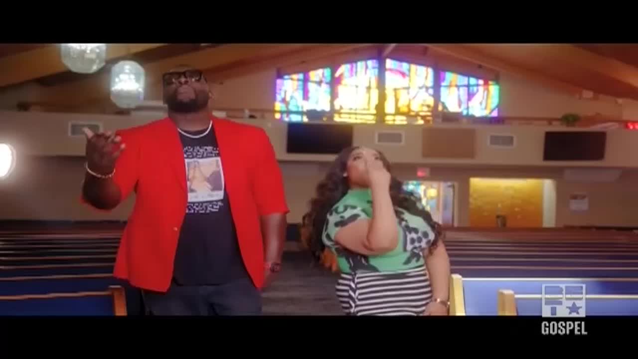 The man in the red blazer gestures with his right hand as if he's making a point. Beside him, a woman in a patterned top touches her face, and the BET Gospel logo is visible in the corner.
