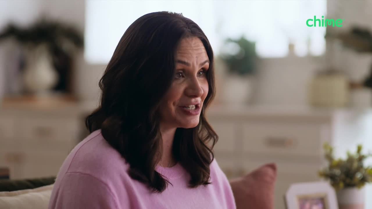 A woman in a pink sweater is talking, her mouth moving as she speaks. The Chime logo is visible in the top right corner.
