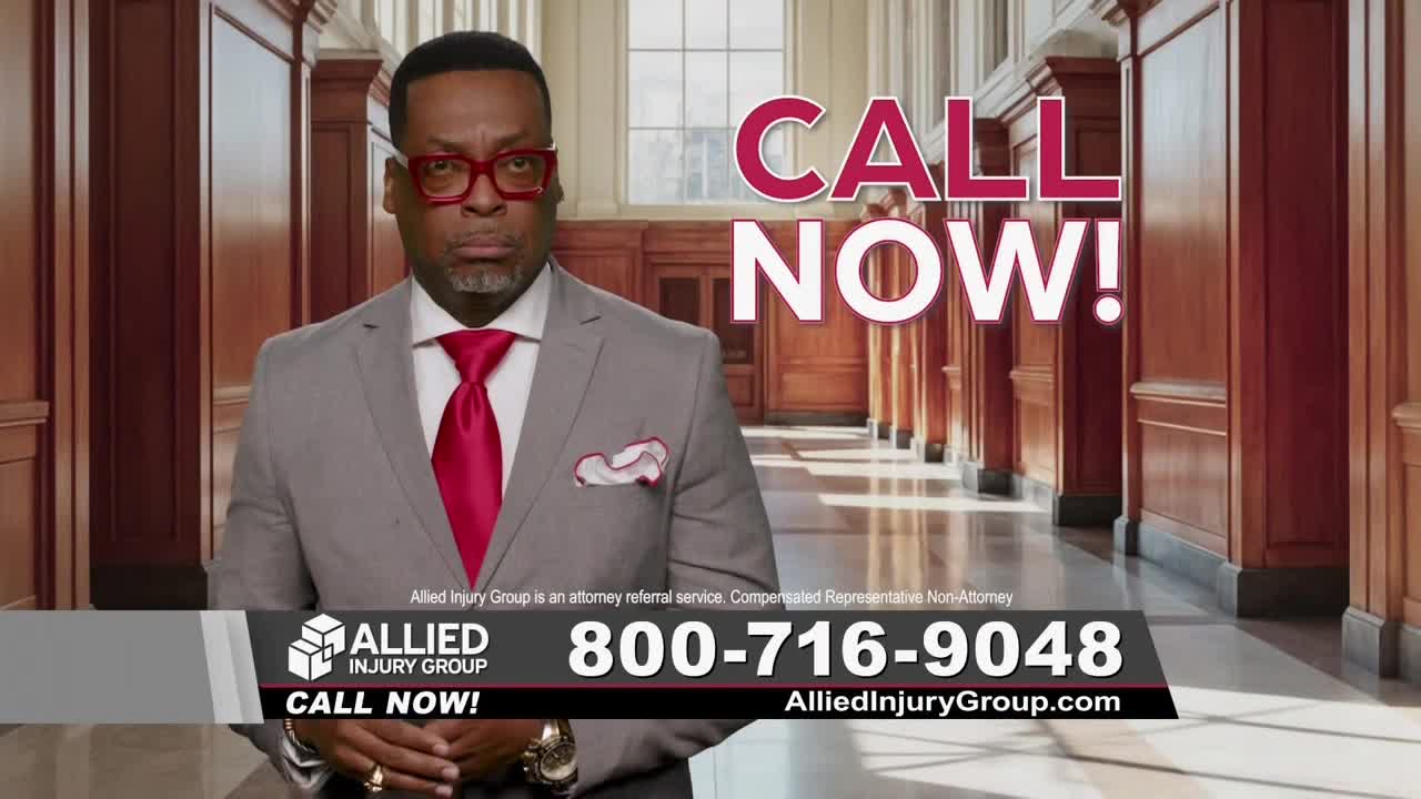 A man in a gray suit and red tie stares directly at the camera, a stern expression on his face. Above him, large pink letters command viewers to "CALL NOW!"
