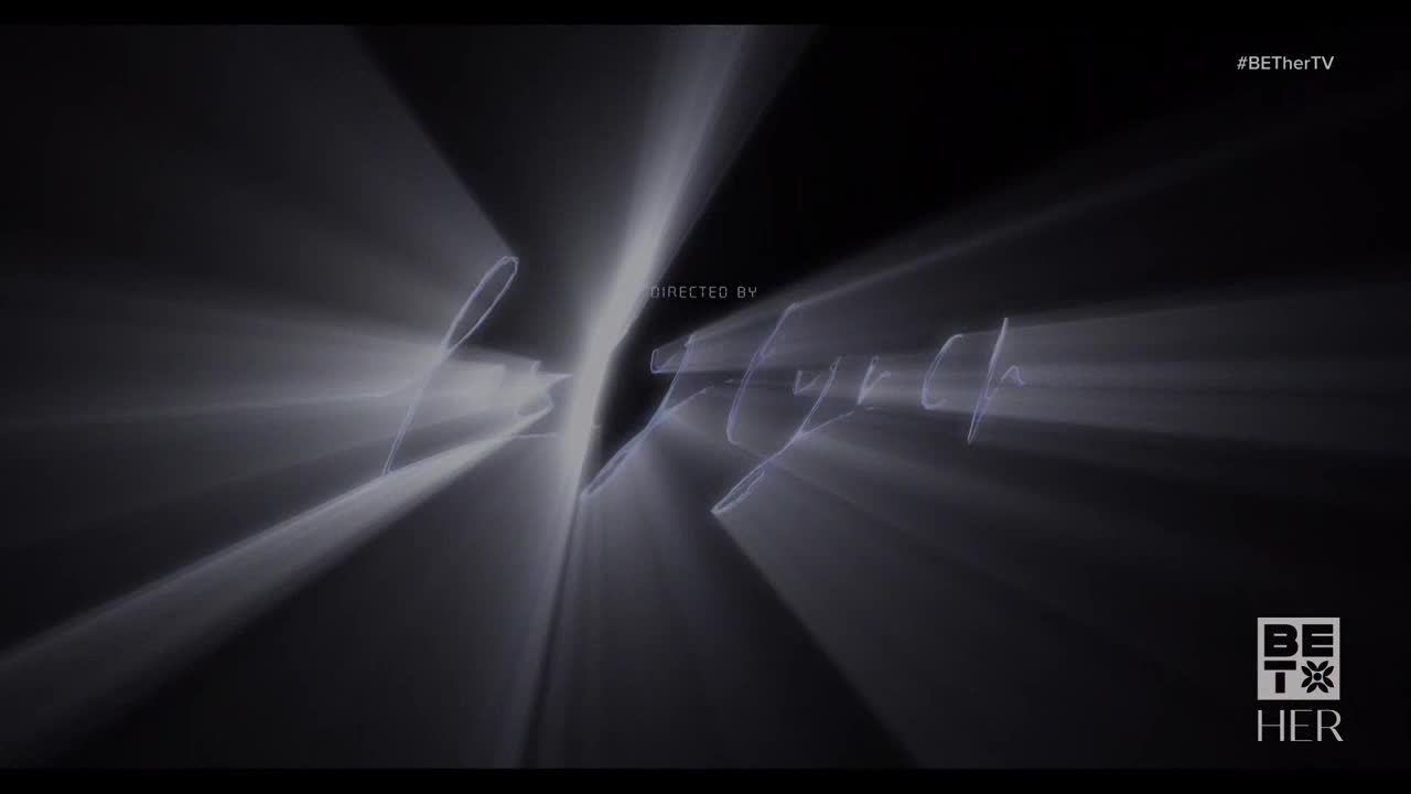 Bright, white light streaks across the screen, converging on a stylized signature. Below, the BET Her logo appears, anchored in the lower right.
