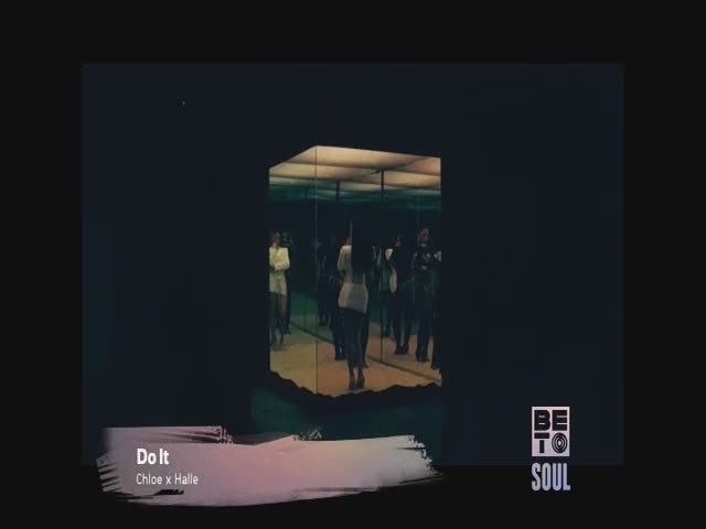 Reflections of people in white blazers and black clothing fill a mirrored box, the light catching their movements. The BET Soul logo sits in the bottom right corner, and the song title "Do It" is displayed on the screen.
