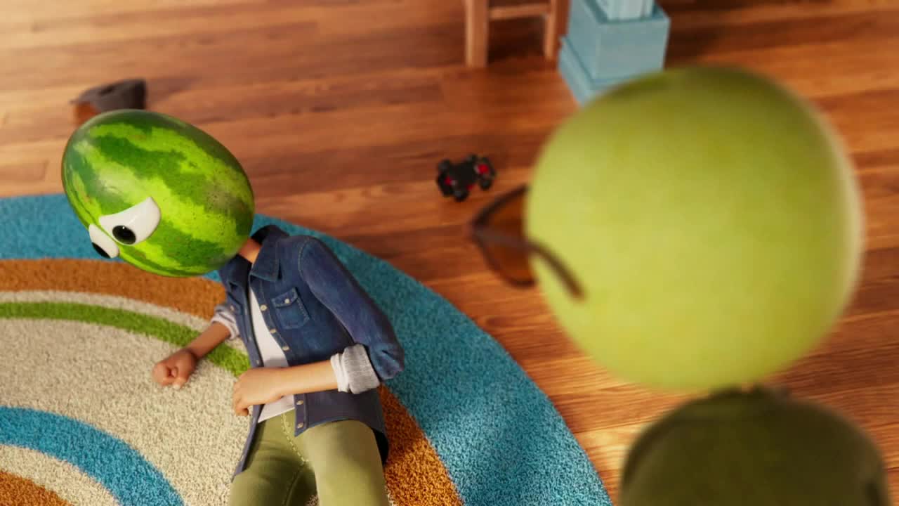 A person wearing a watermelon head lies on a rug, looking down. Another person with an apple head is nearby, wearing sunglasses.
