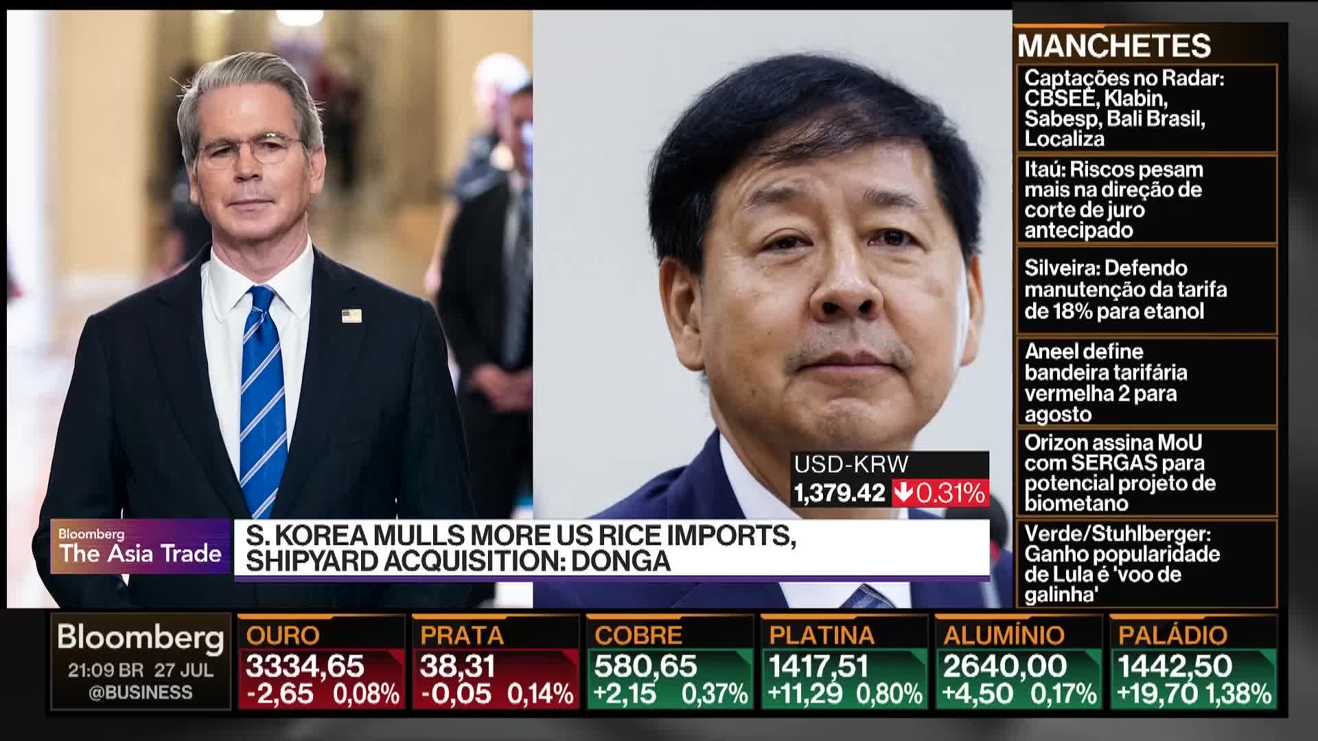 On Bloomberg TV, a man in a suit and tie from the United States is on screen, while a headline discusses South Korea and rice imports. Next to him, a man's face is displayed with a currency ticker below.
