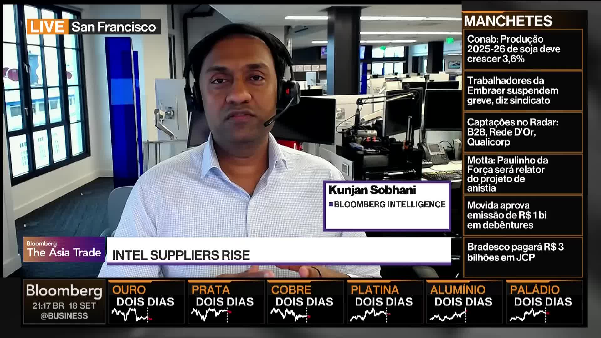 A man wearing a headset is speaking on Bloomberg TV from San Francisco. Graphics on the screen indicate the topic is Intel suppliers and a news ticker is running.
